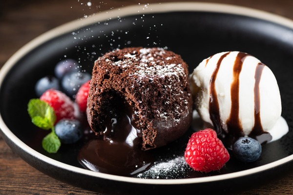 smooth cake and ice cream with berries on a plate