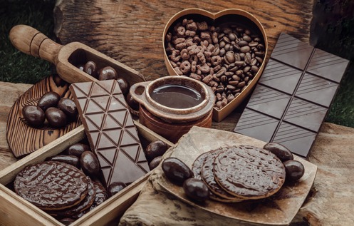 different kinds of dark chocolate laid out on wooden boards