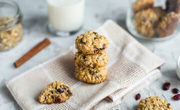 Breakfast biscuits containing soy lecithin with cranberries and a glass with milk