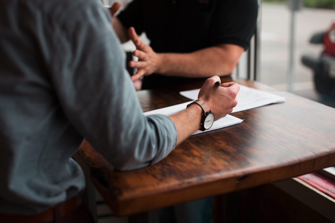 two people working together at a table