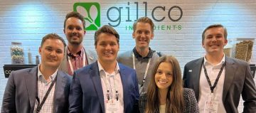 Four Gillco employees laughing and posing together