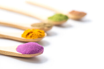 spoons full of colorful powder