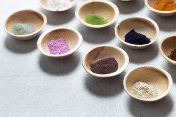 Multiple bowls of natural food color powder