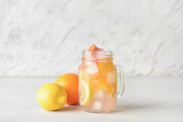 low sugar citrus drink in a glass with ice